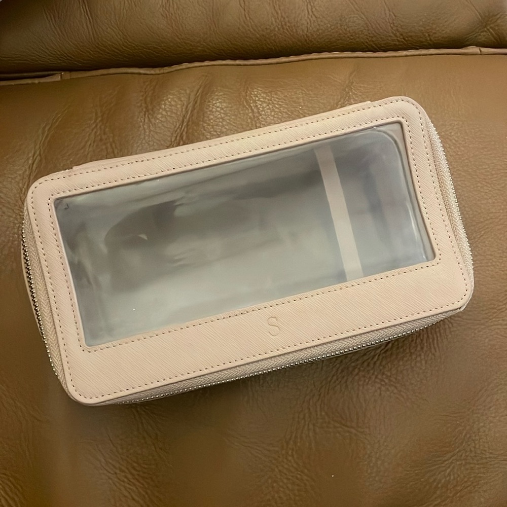 Used in great condition TDE leather makeup case bag with embossed “s”